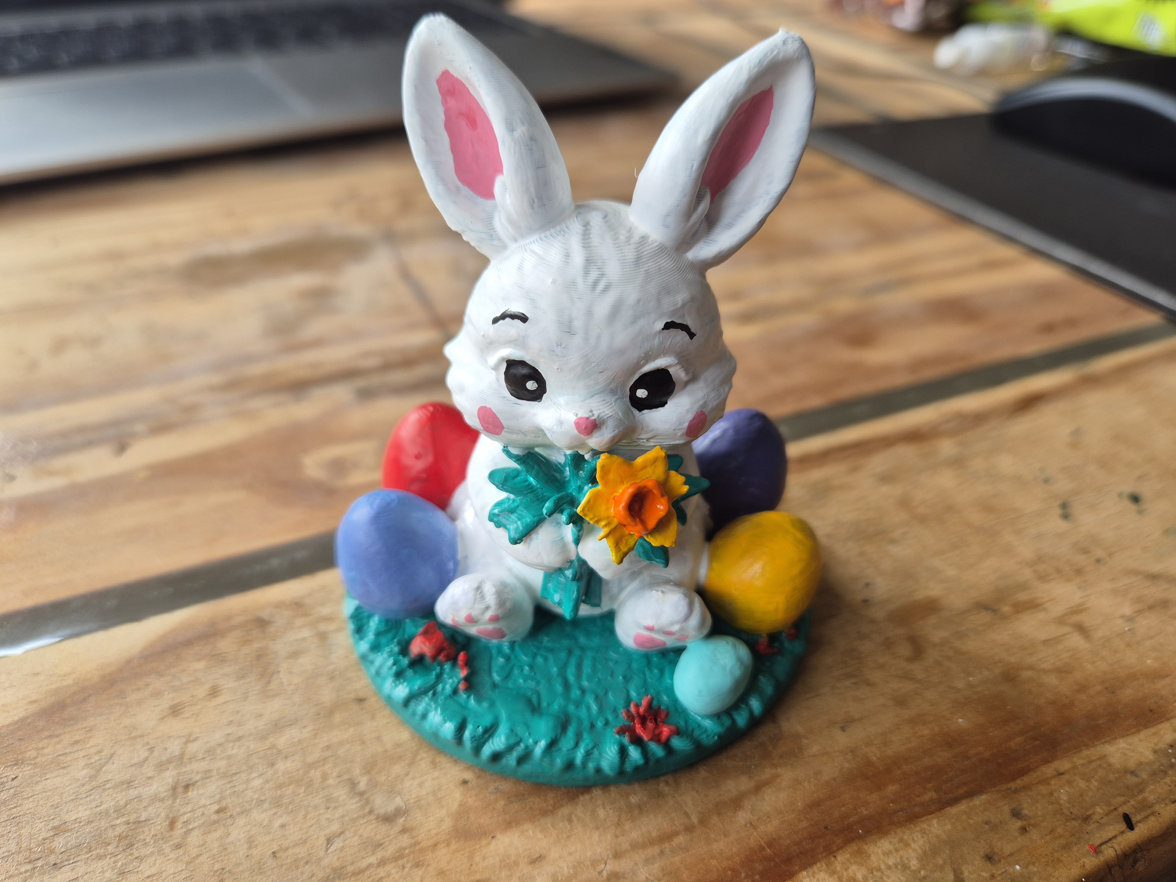 Cute Easter Bunny with eggs and daffodils