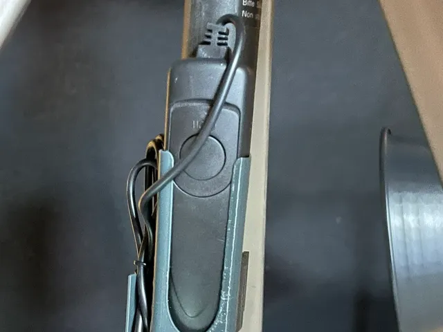 Camera shutter release holder