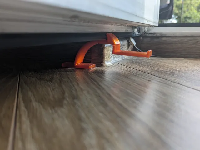 Balcony door holder