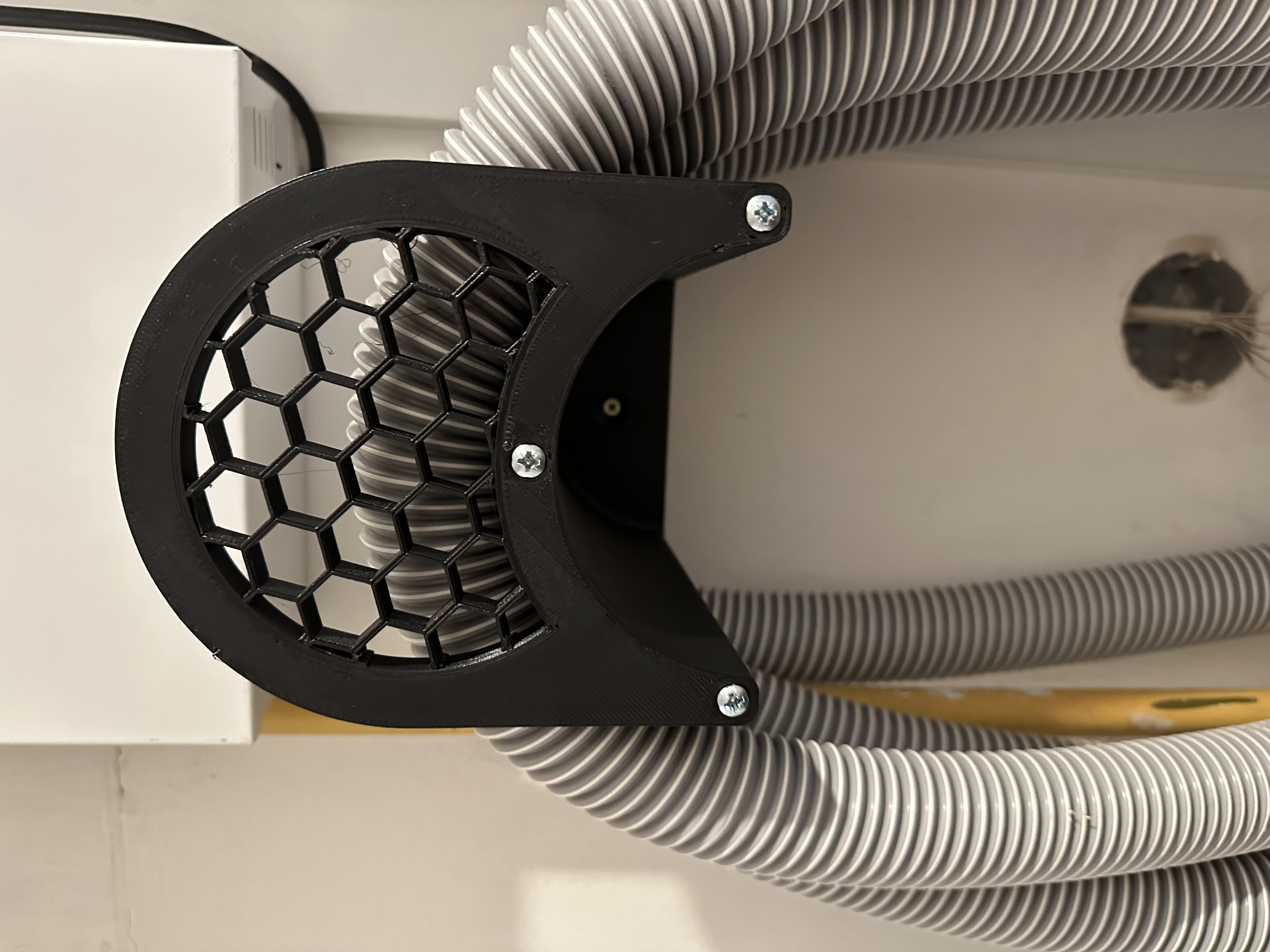 Vacuum hose holder