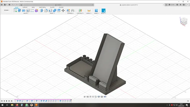 a smartphone, pencil and post it holder
