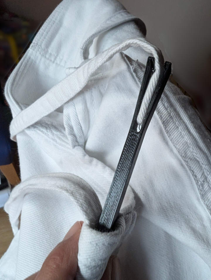 Threading Needle to thread a belt or rope.