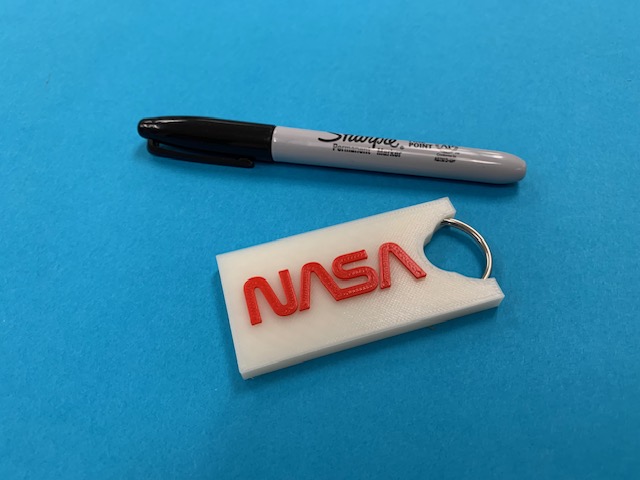 NASA Worm Keychain with embedded keyring.