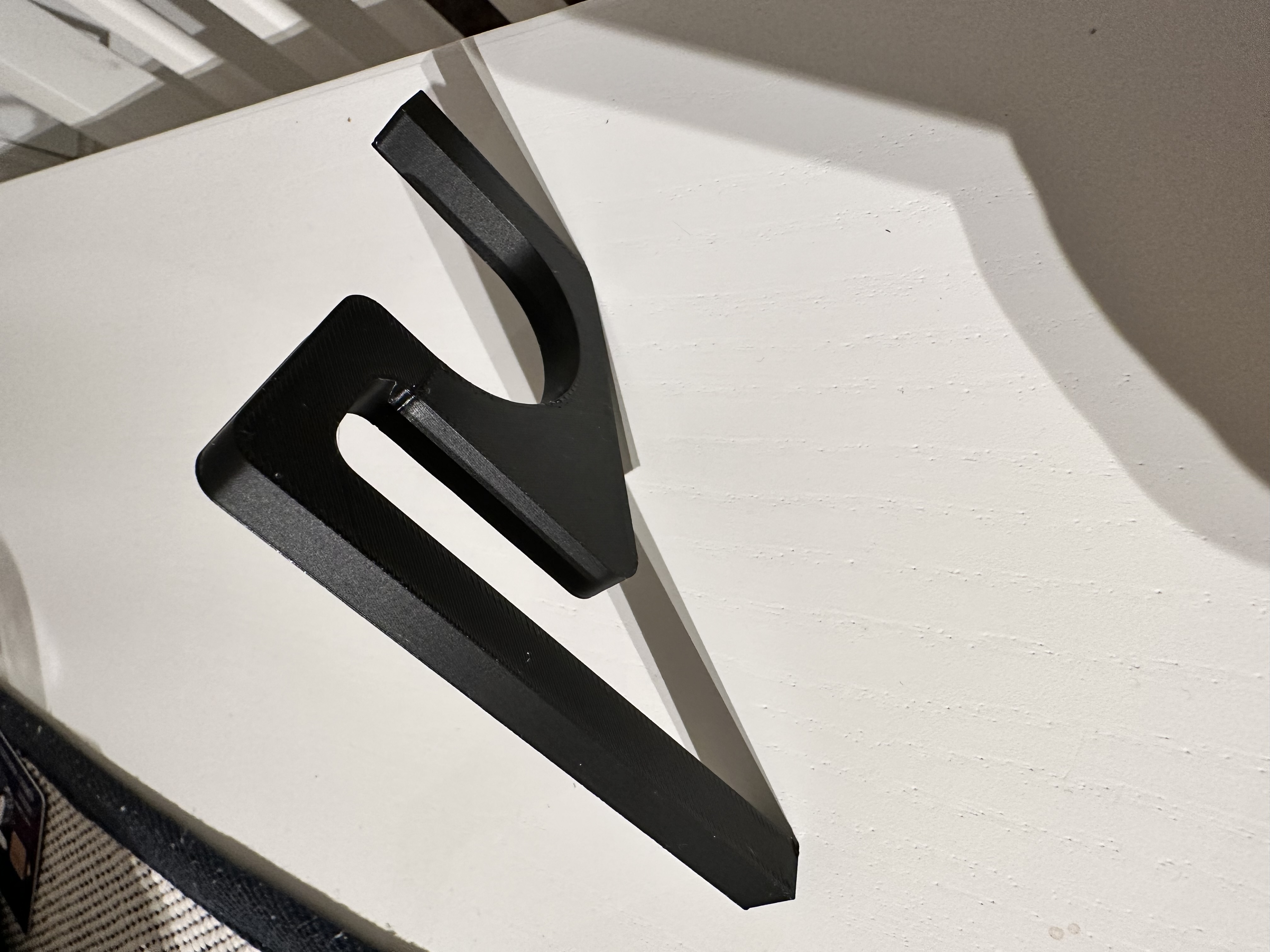 Woom kid bike hook to be carried at a cargo bike.