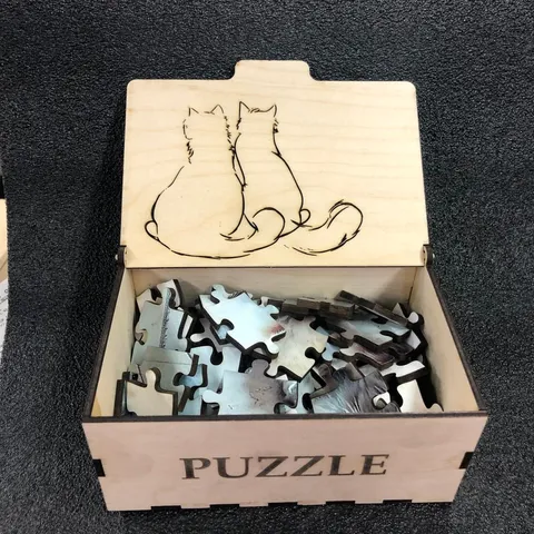 Laser cut box for laser cut puzzle