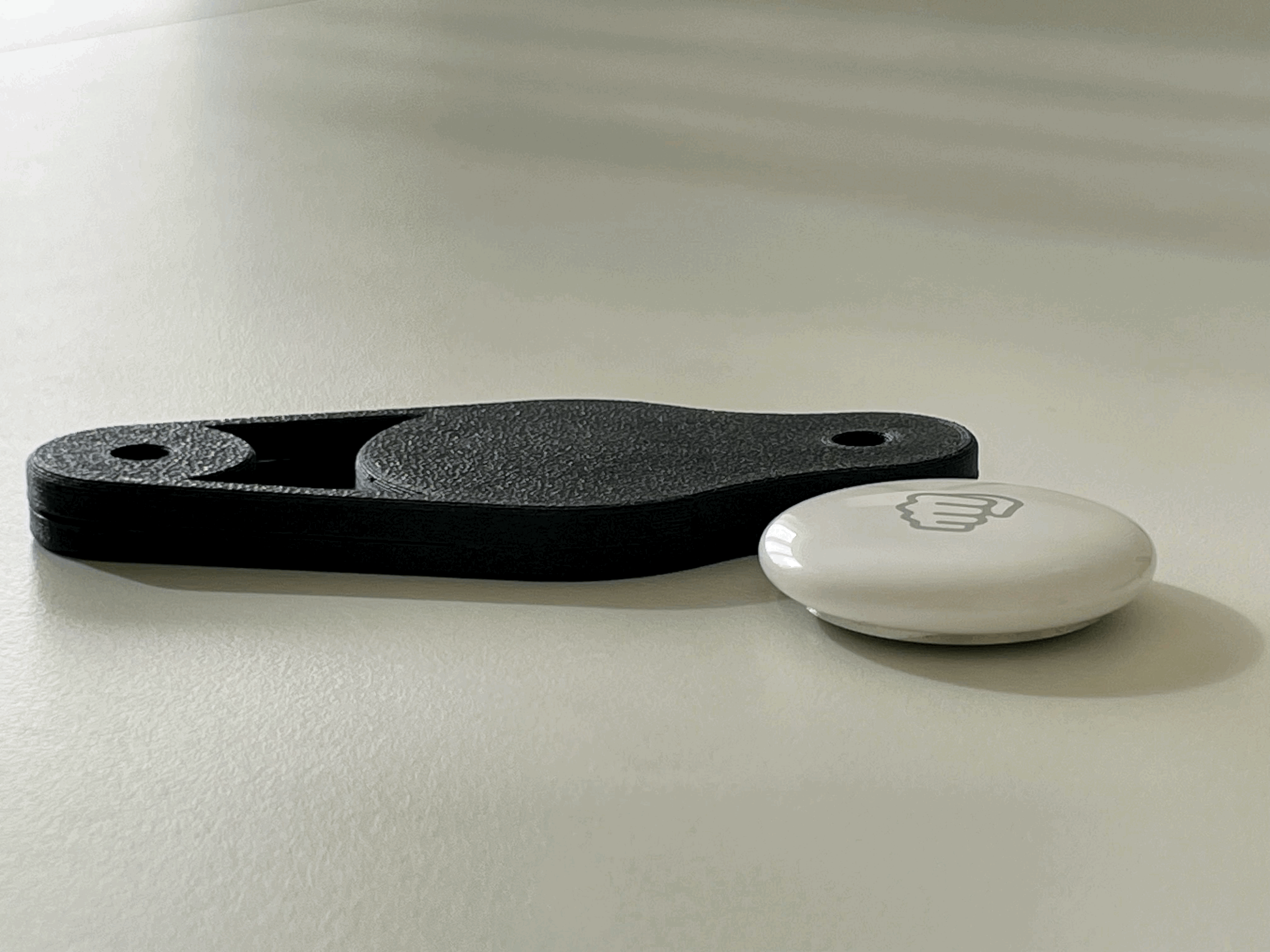 Ultra-thin AirTag bike bottle cage mount
