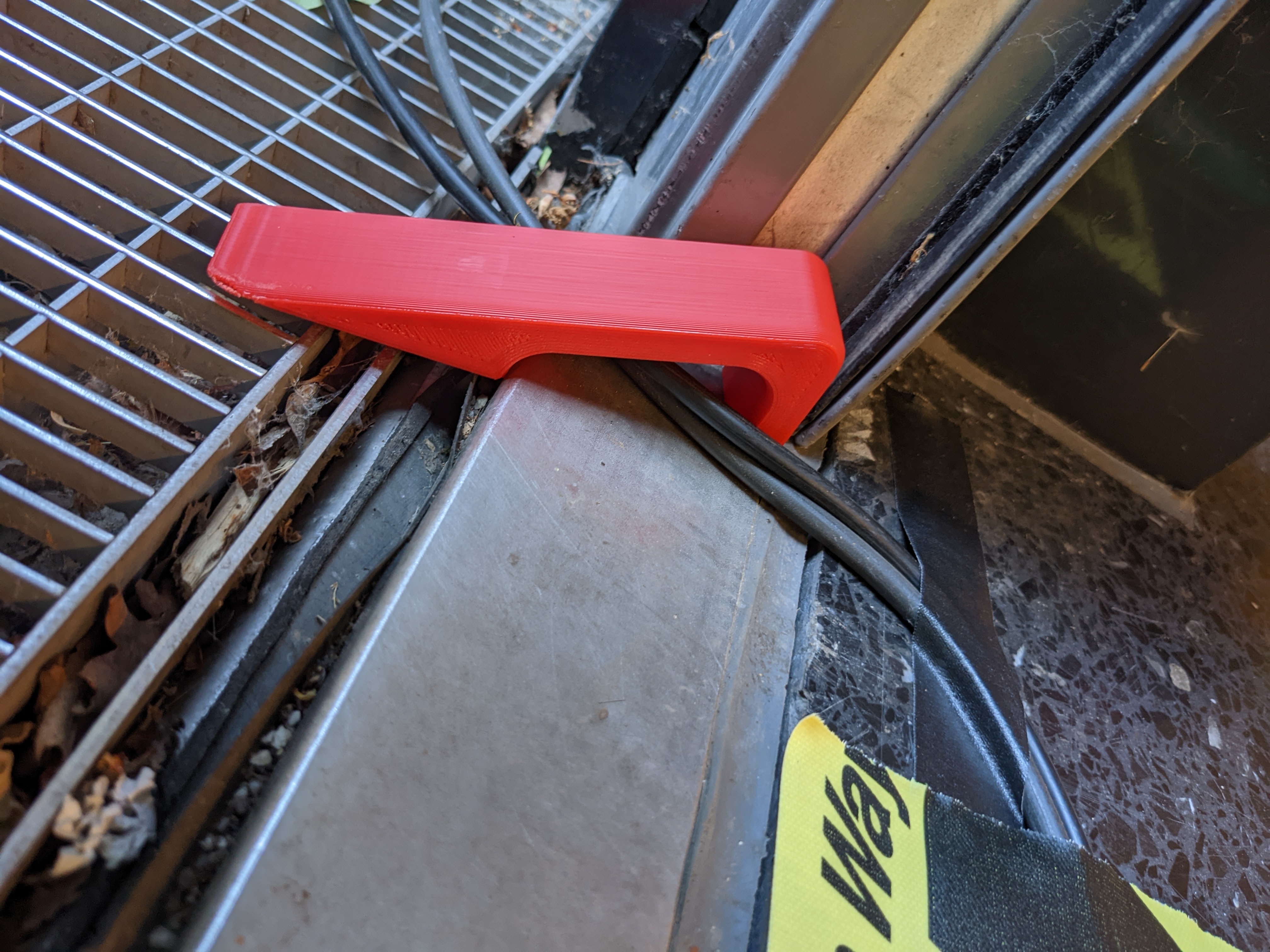 Doorstopper with cable hole