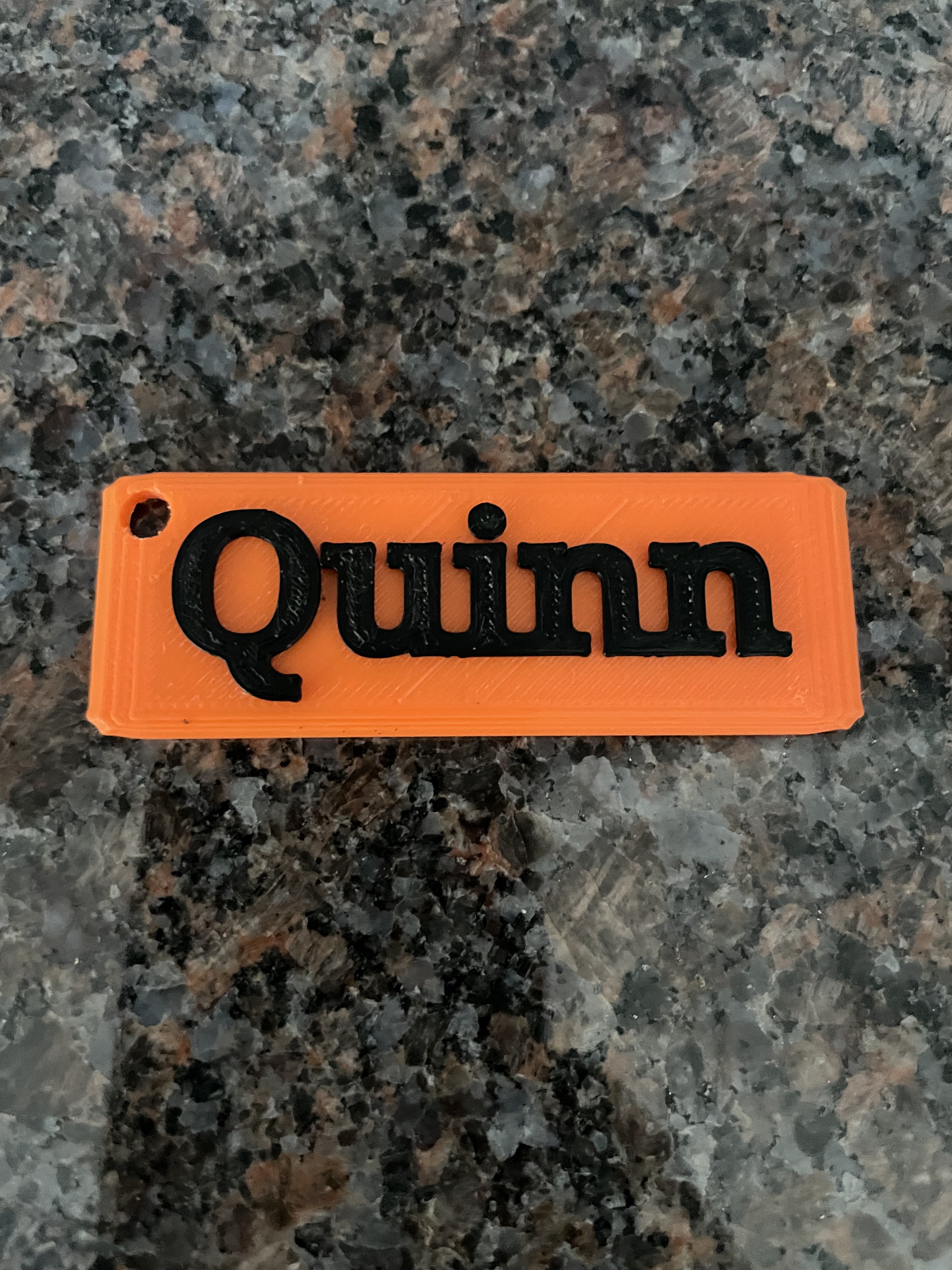 Key chain with name Quinn on it