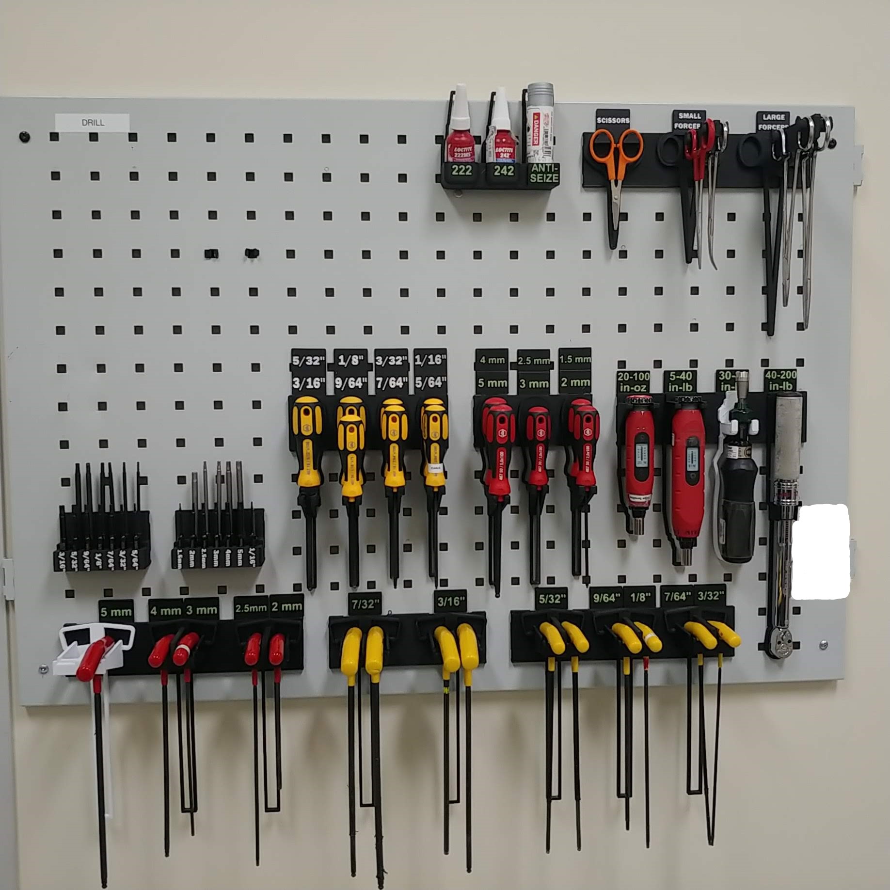 Compact, specific hand tool holders on peg board by Trevor Download
