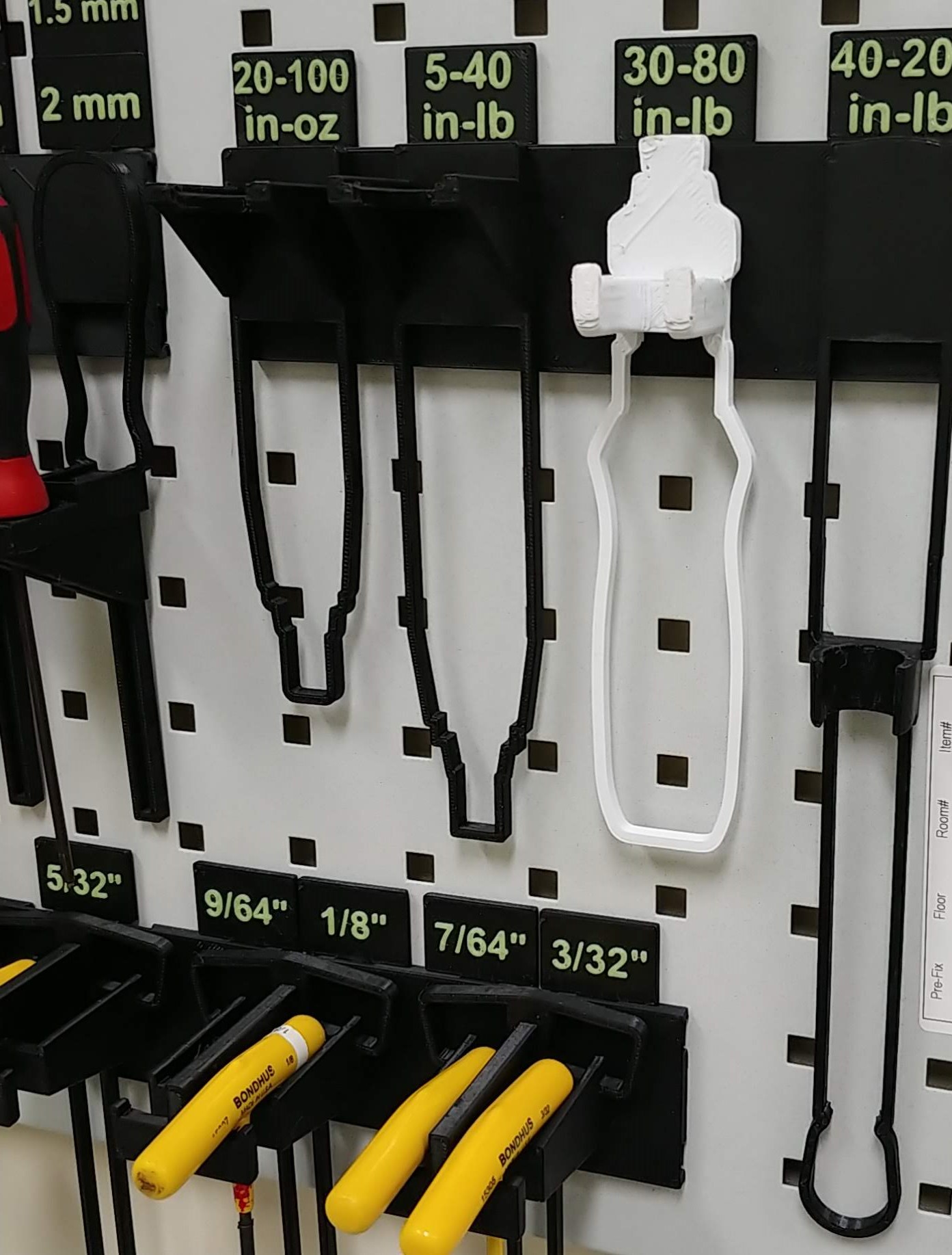 Compact, specific hand tool holders on peg board by Trevor Download