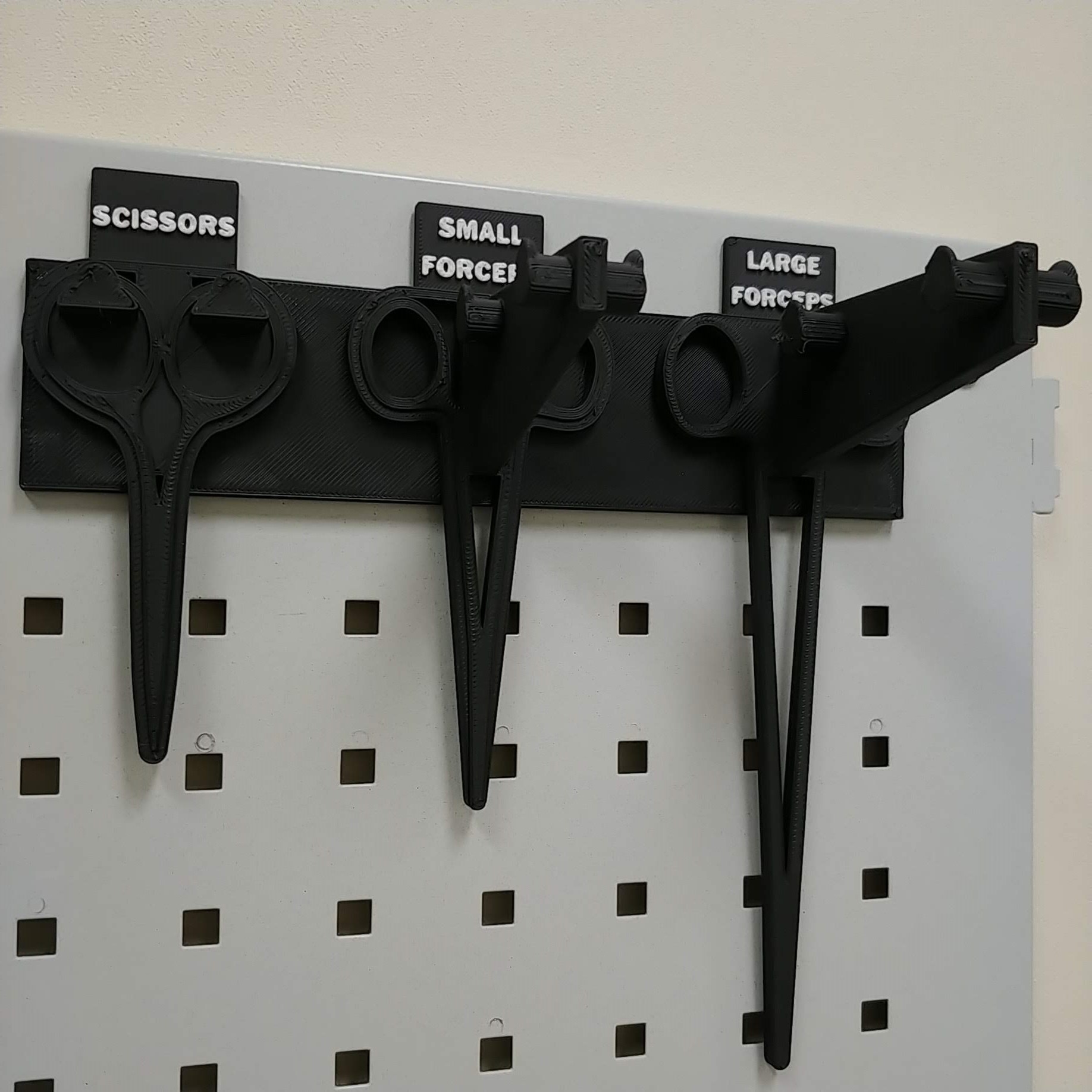 Compact, specific hand tool holders on peg board by Trevor Download