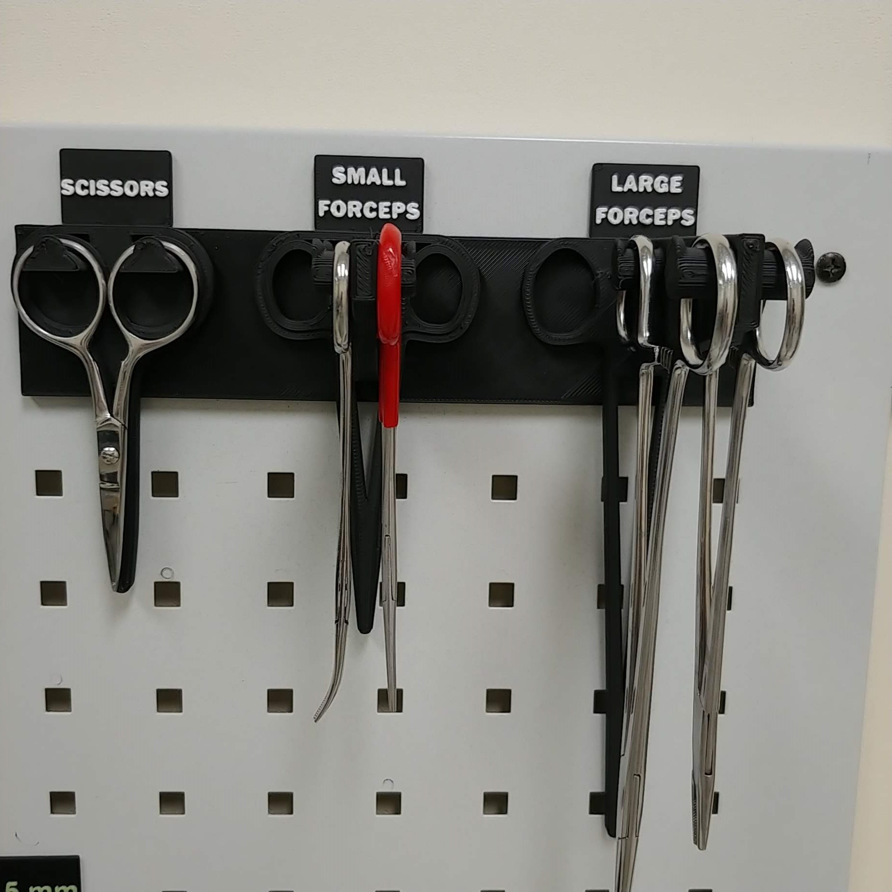 Compact, specific hand tool holders on peg board by Trevor Download
