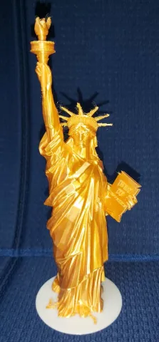 Statue of Liberty with base building and text