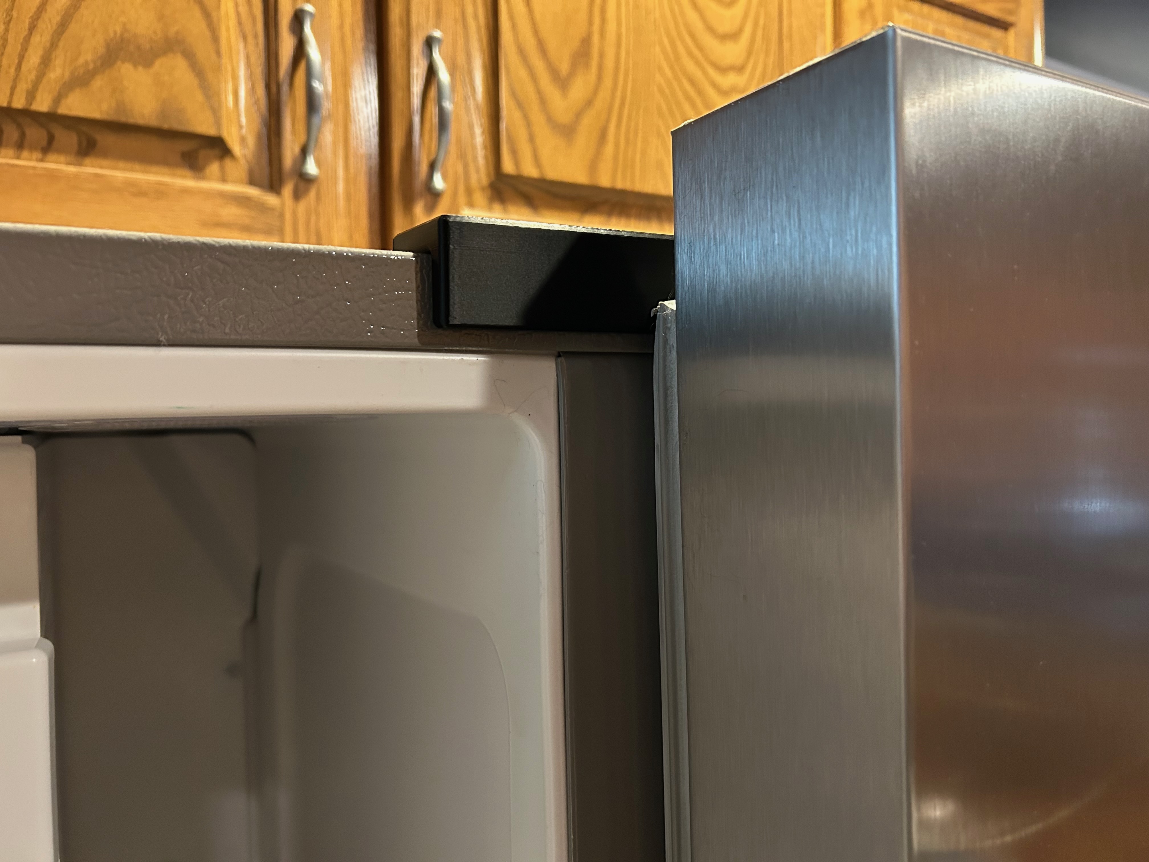 Refrigerator door prop open thingy