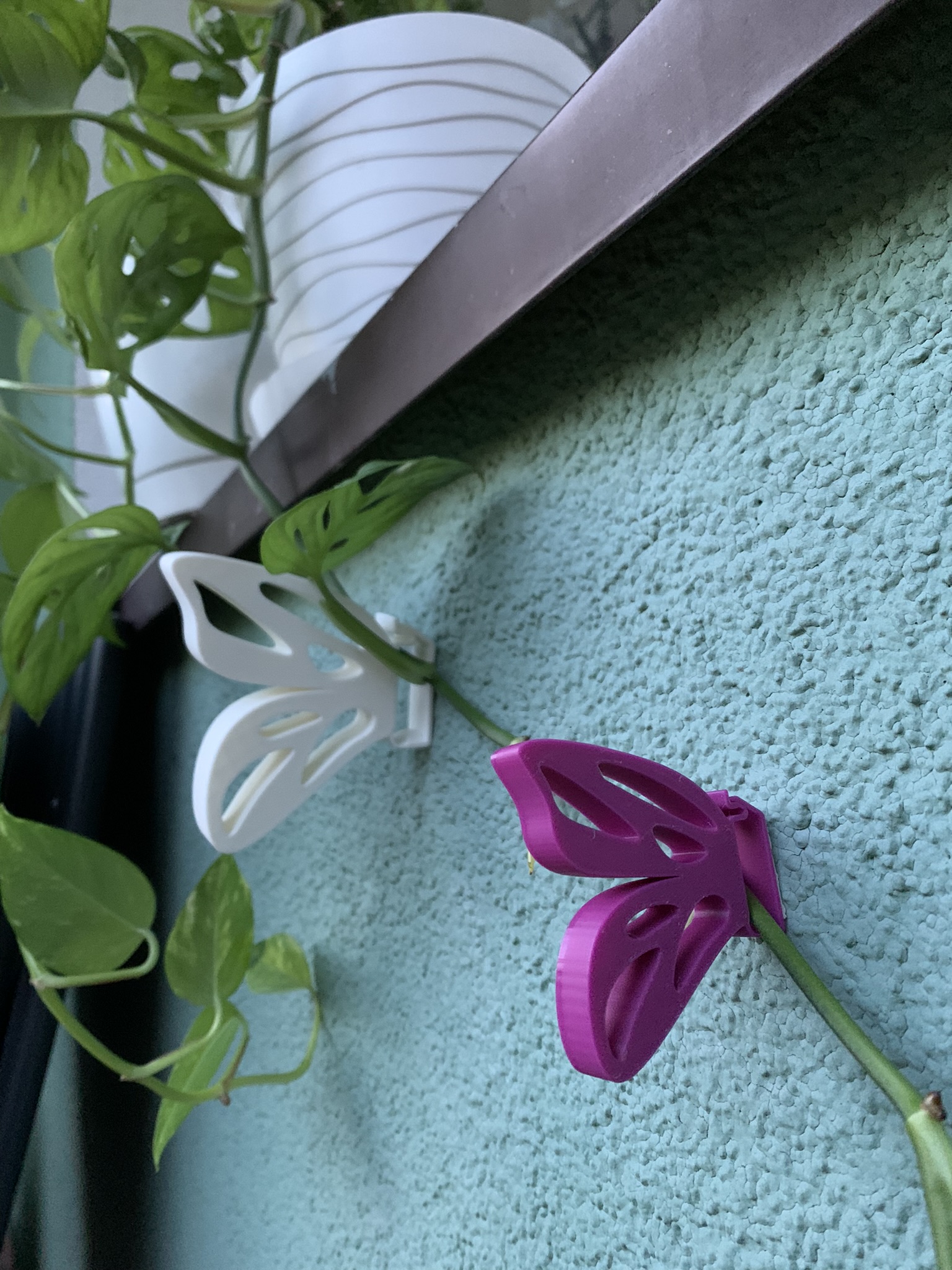 Butterfly climbing plant clip