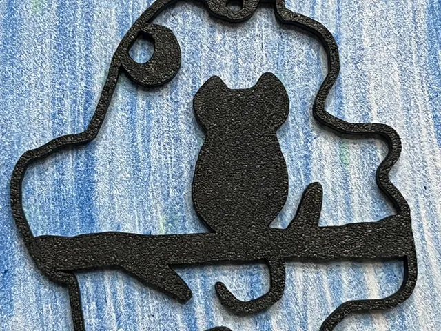 Cat on branch wall decoration