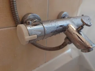 Thermostatic bath faucet end cap