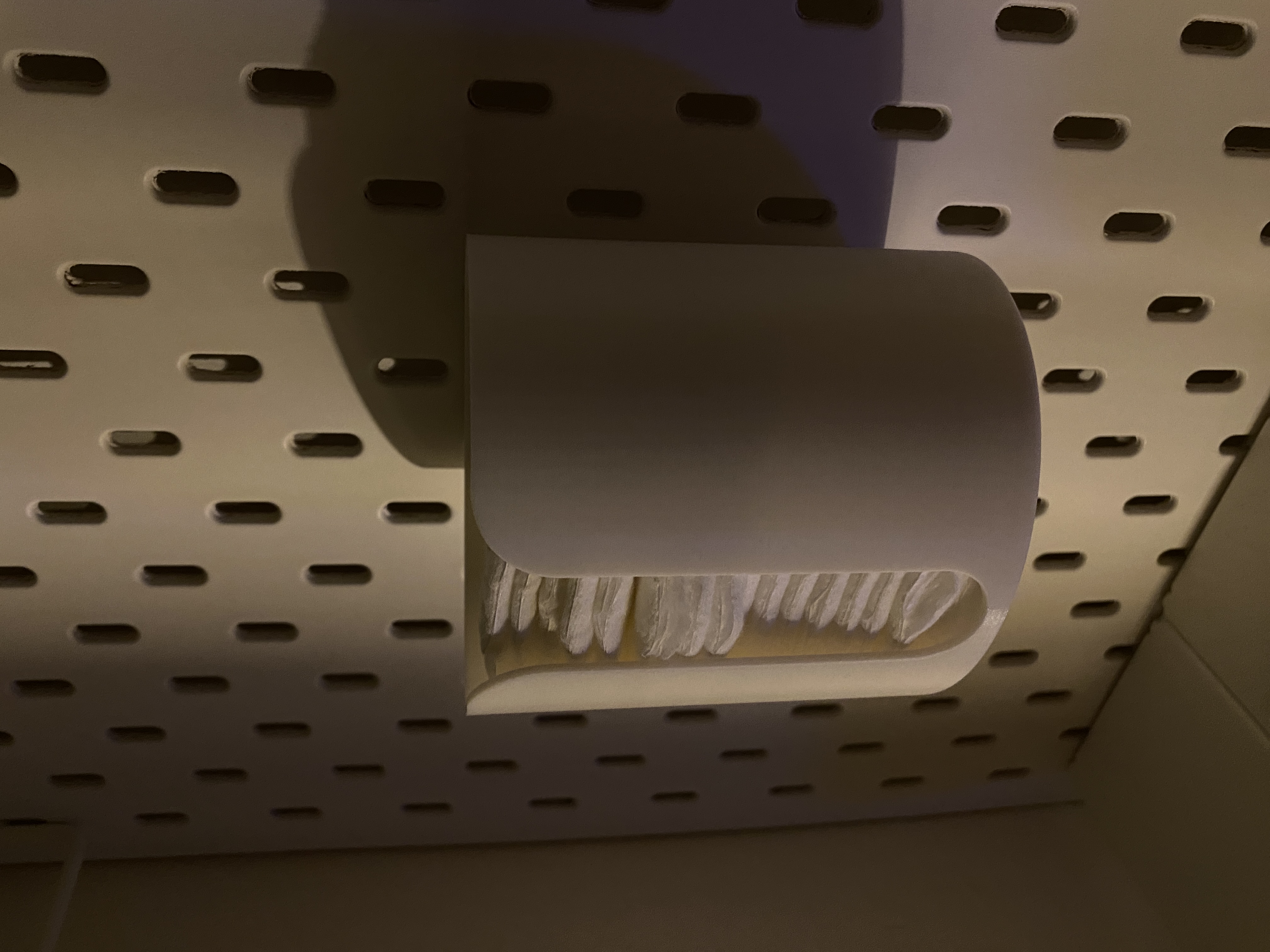 Skadis holder for cleaning pads