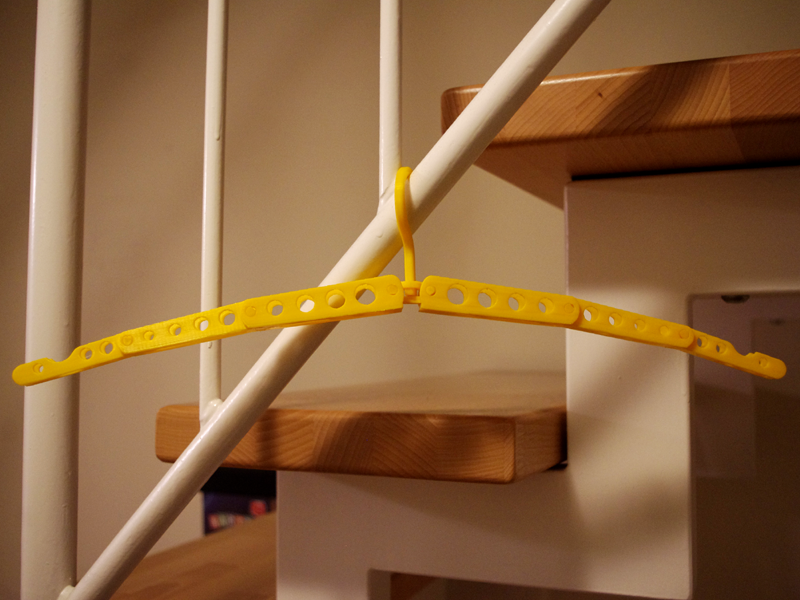 Folding travel coat hanger