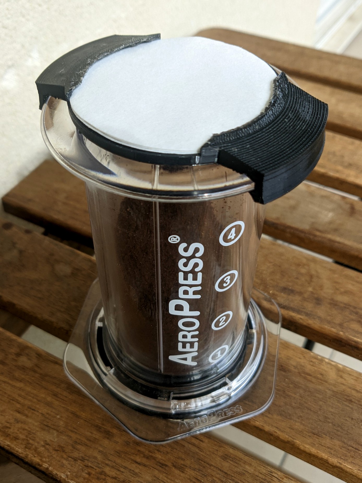 Compact Aeropress travel cap for coffee and filters