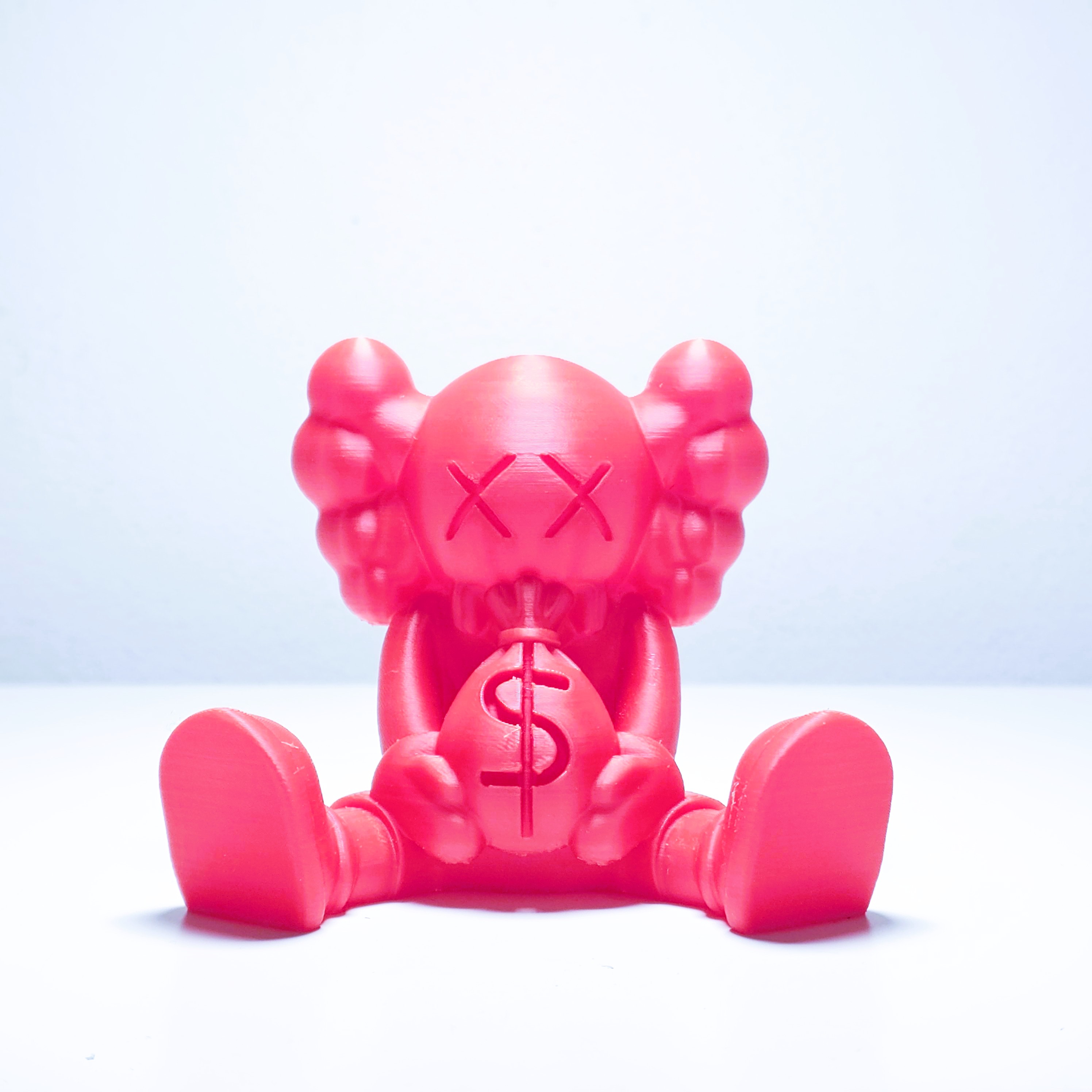 Kaws money bag figure