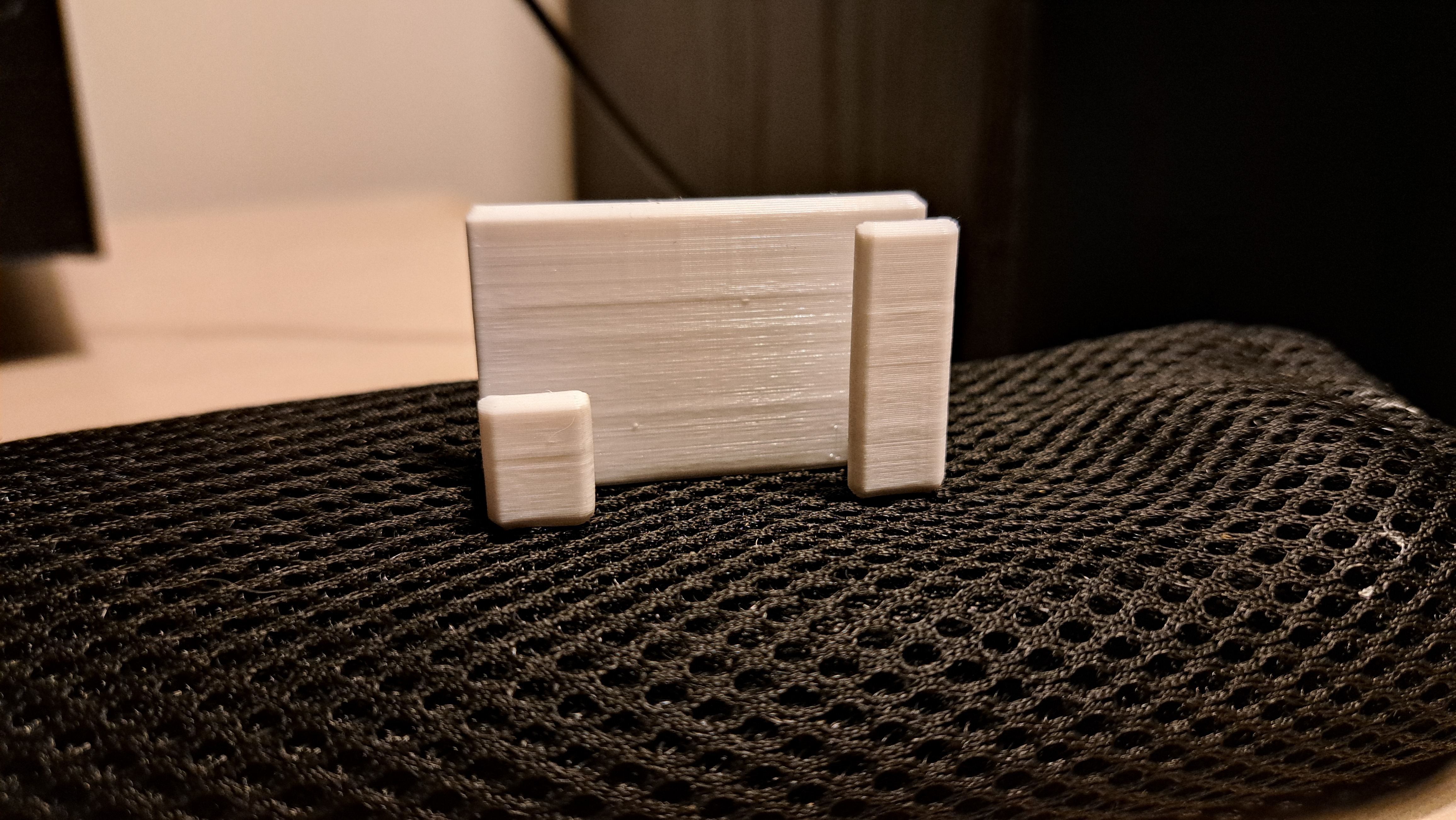 Caliper holder for honeycomb storage wall