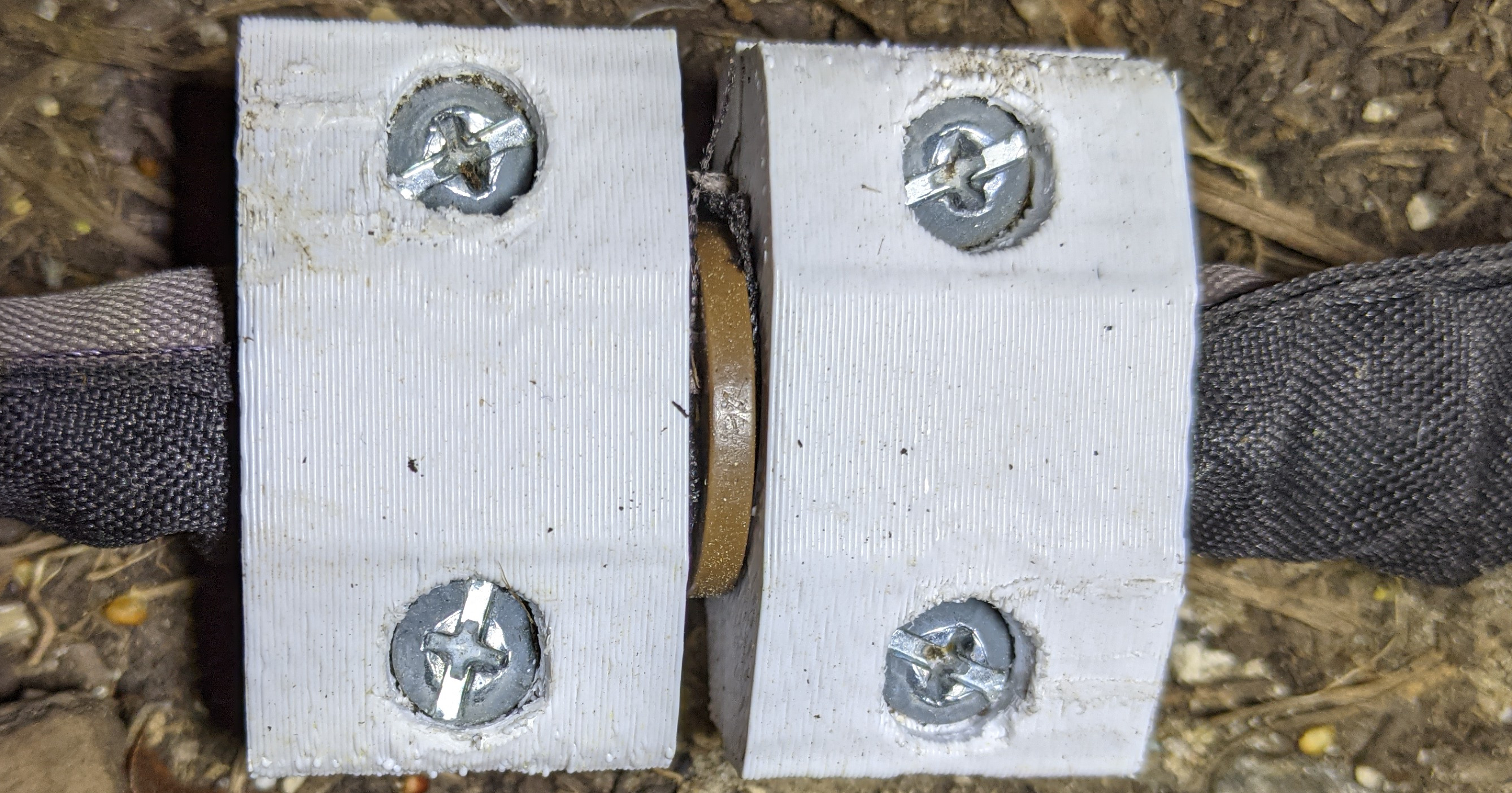 Bracket for fabric soaker hoses
