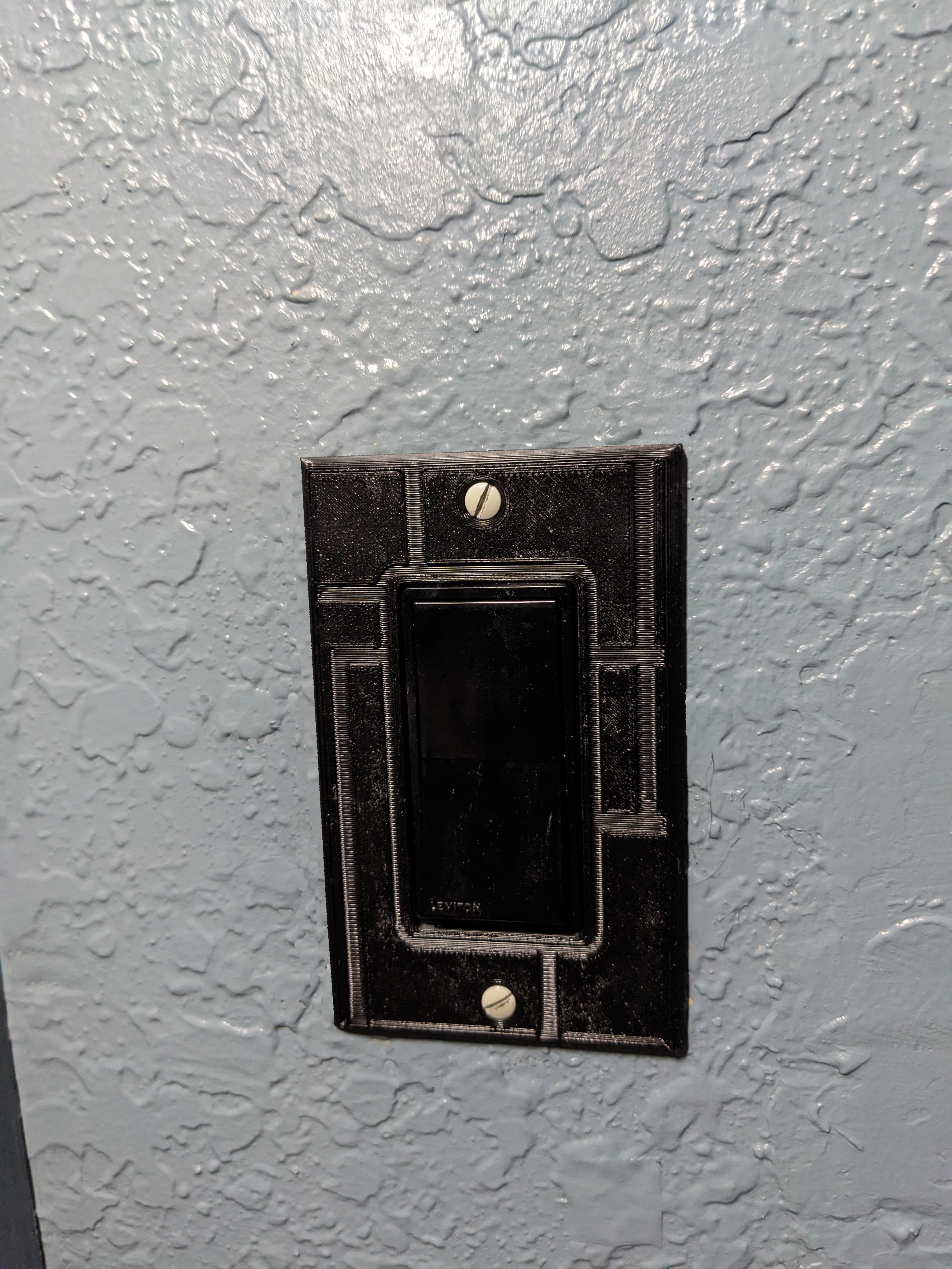 "Modern" design rocker switch cover.