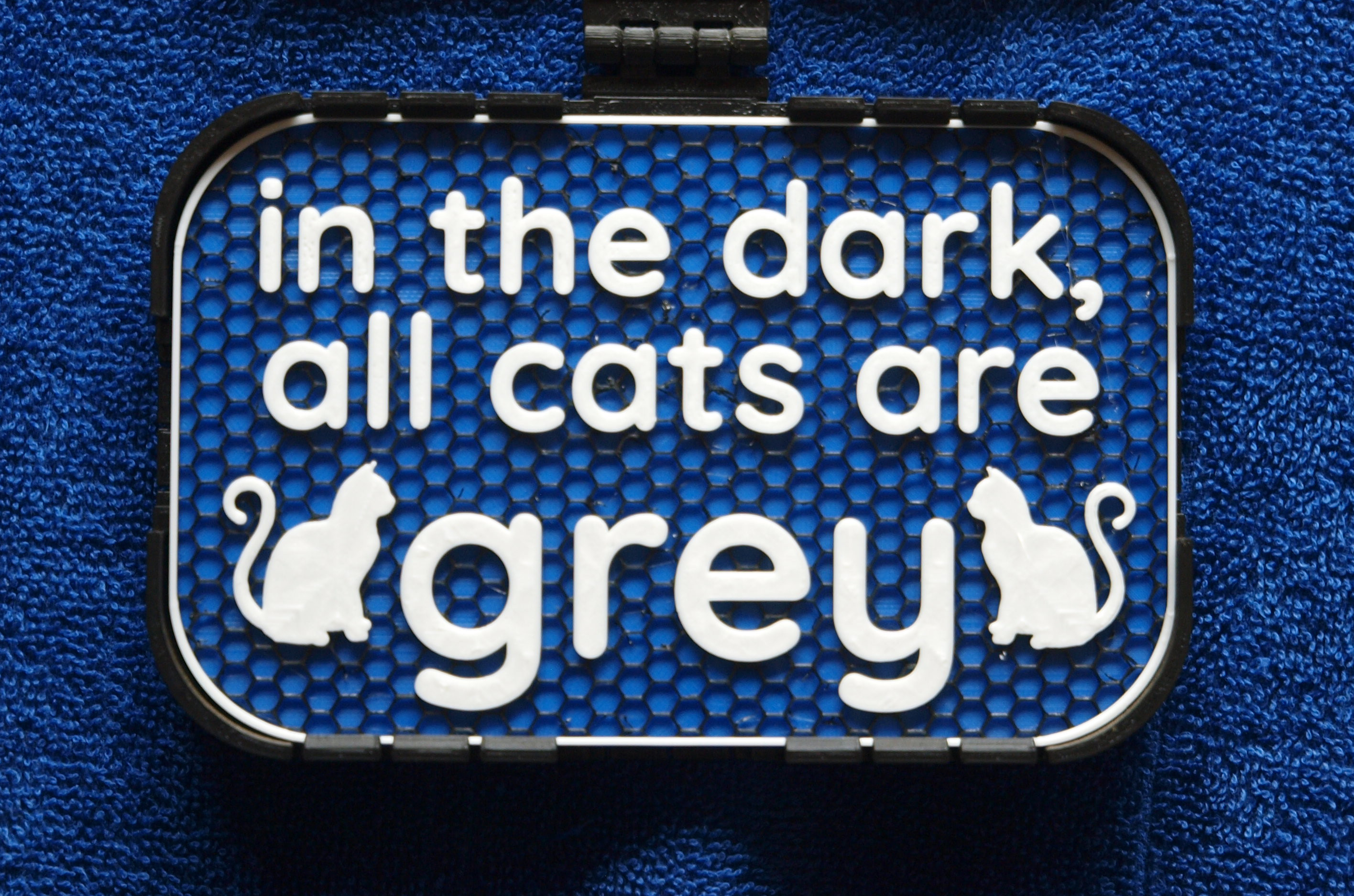 "All cats are grey" sign