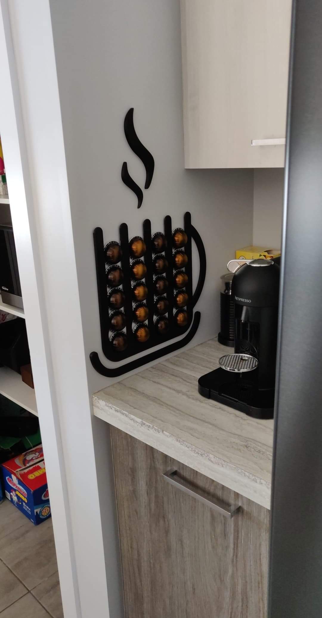 Wall mounted, mug shaped Nespresso Vertuo capsule dispenser
