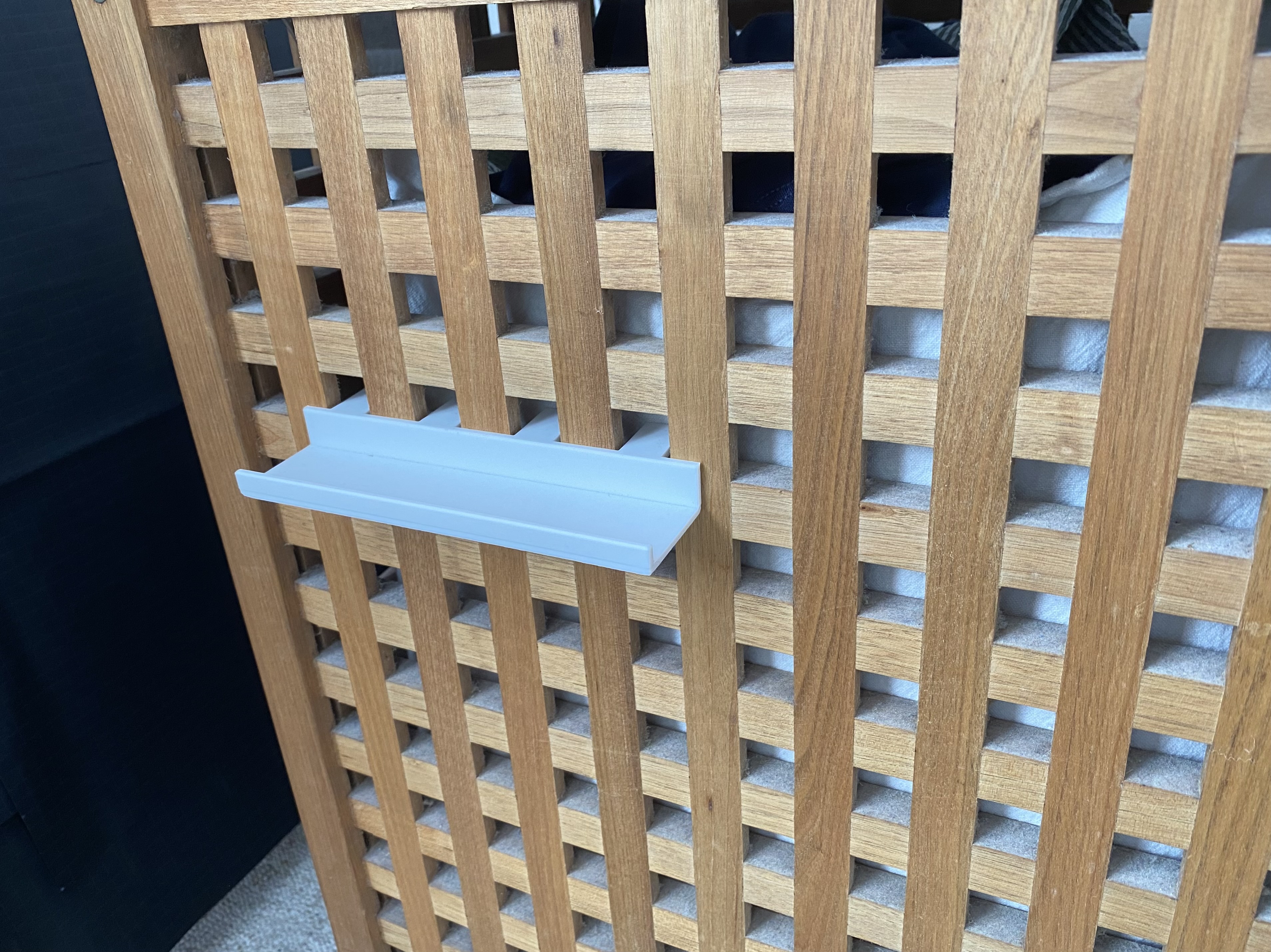 Very simple laundry basket phone shelf
