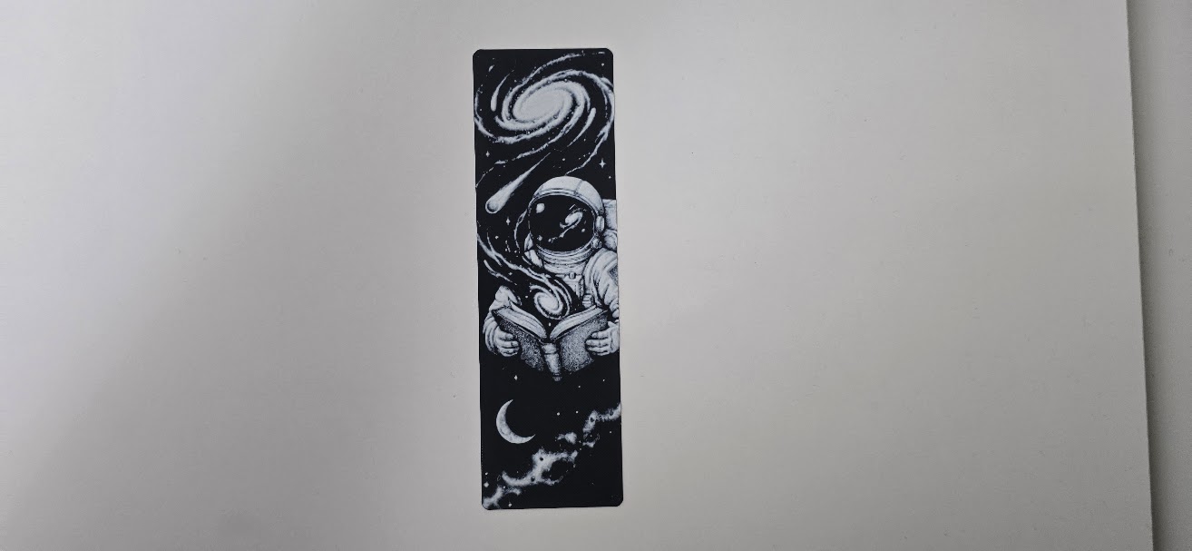 Astronaut Reading in Space Cosmic Bookmark