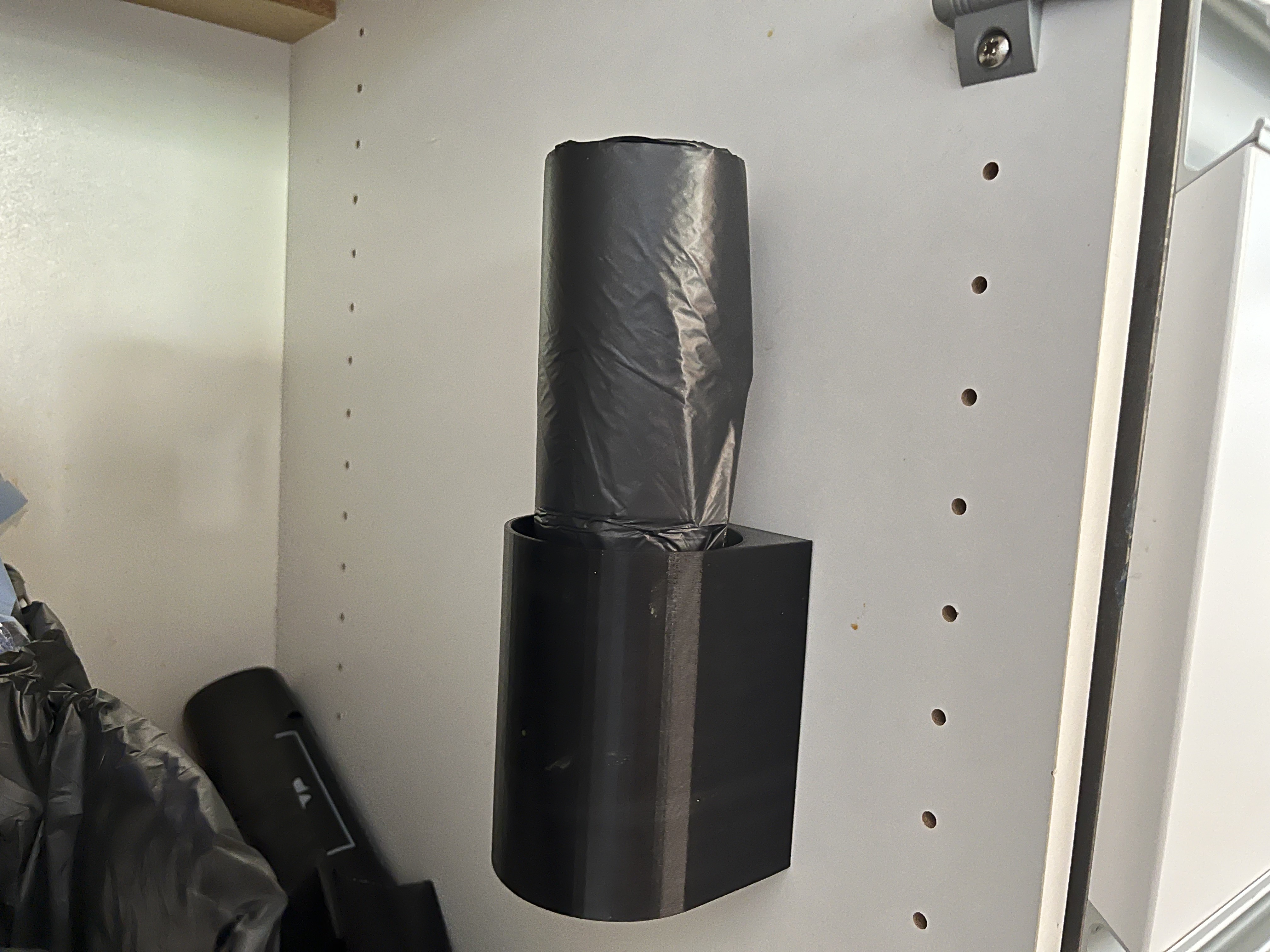 Vertical garbage bag roll holder
