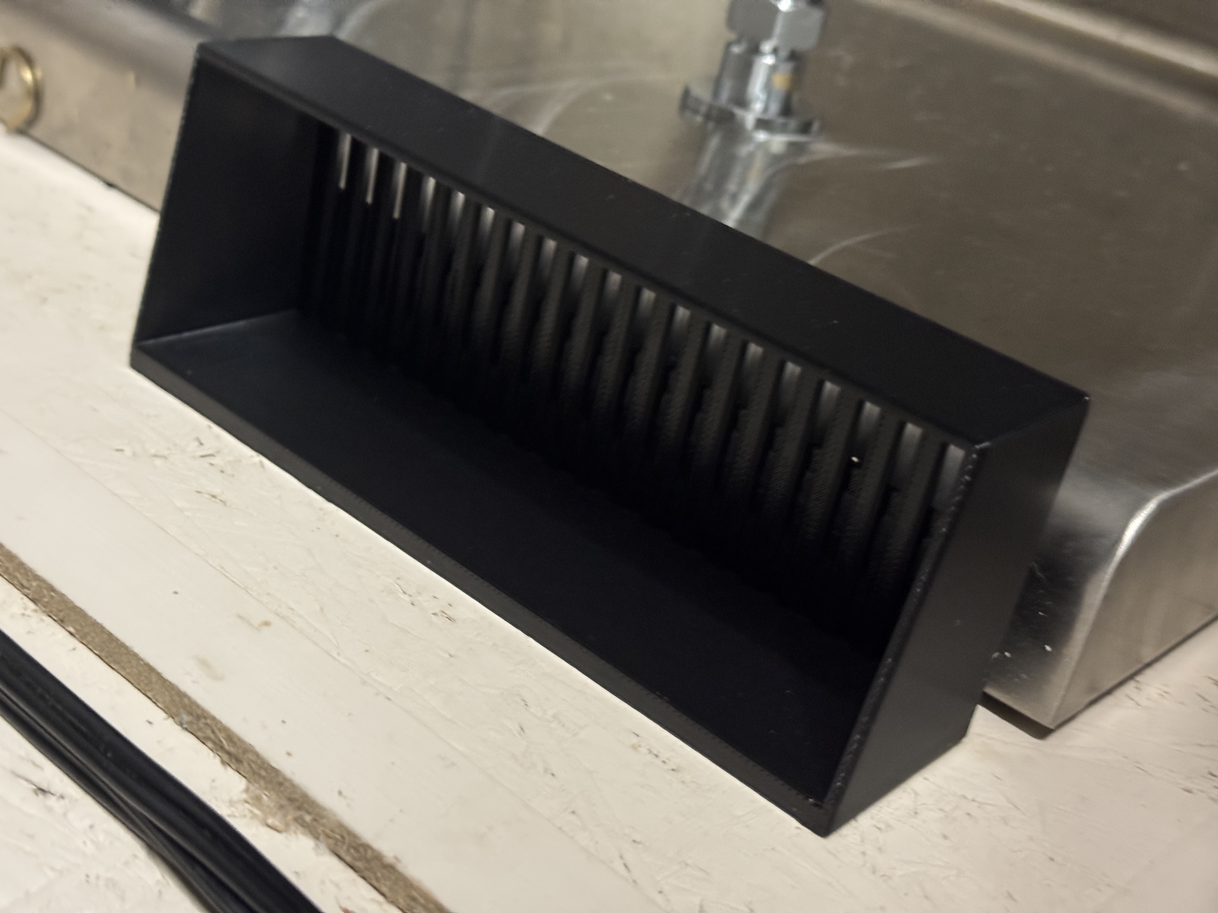 Draining wall mounted drain basket