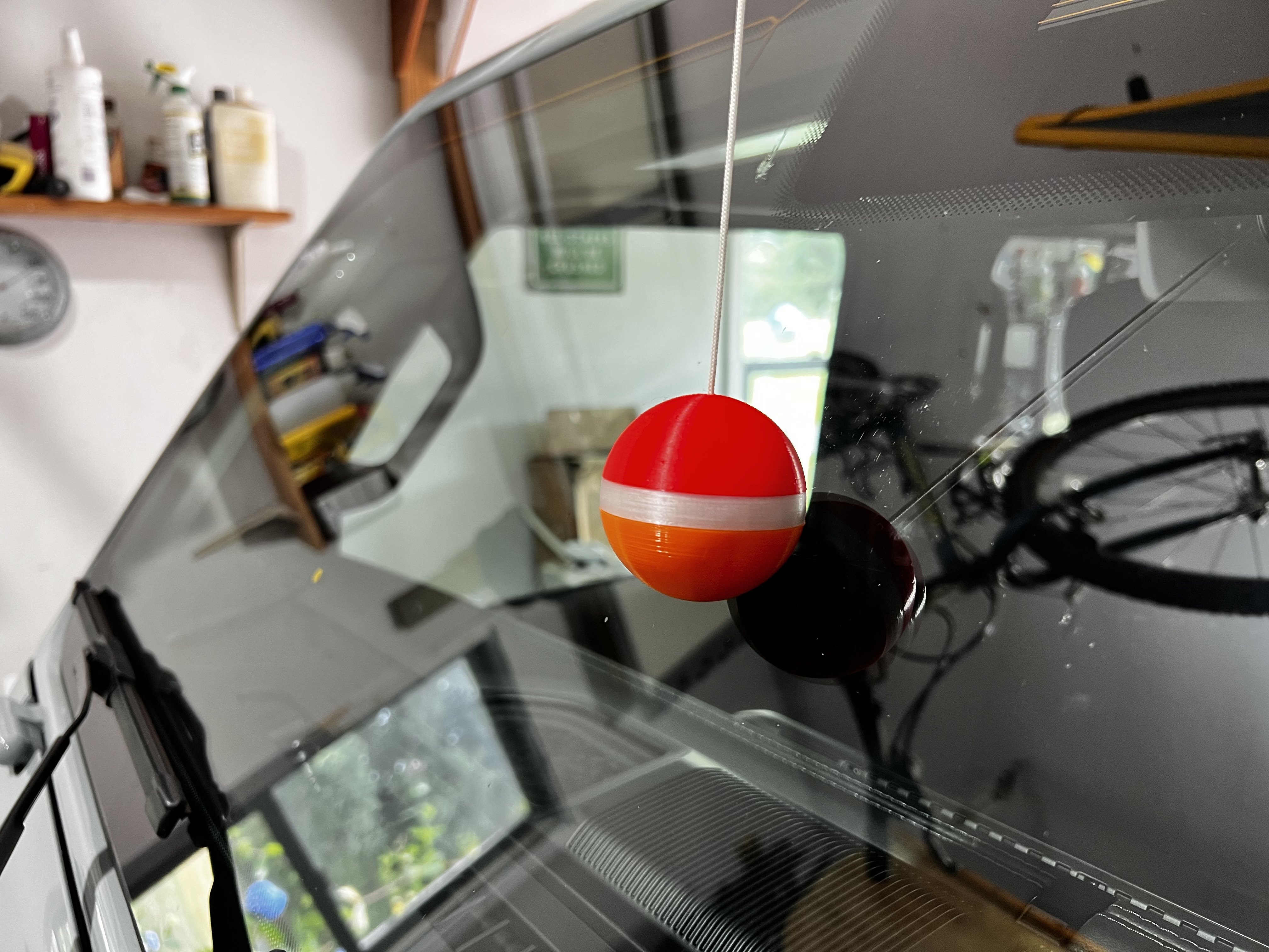 Garage parking assist, 2 Inch ball with provision to suspend with a string to help judge how far to pull into the garage.