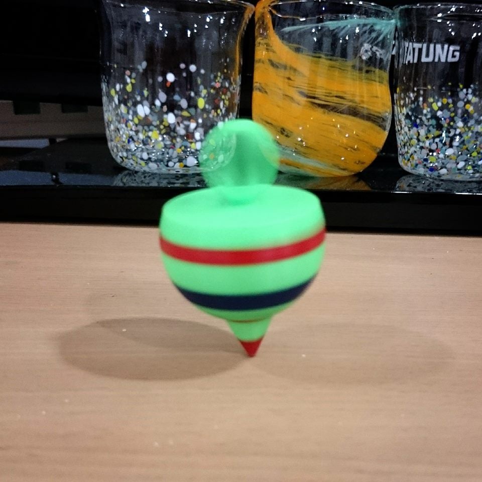 Spinning top ring