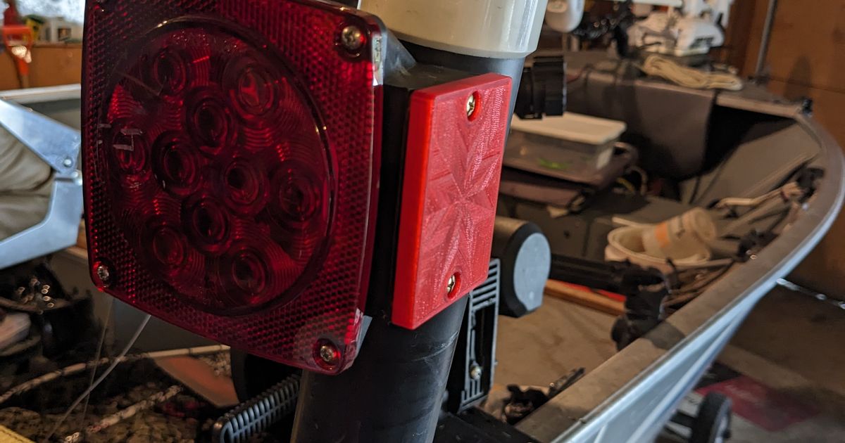 Sidelight cover for boat trailer tail light assembly by Dan Rogers