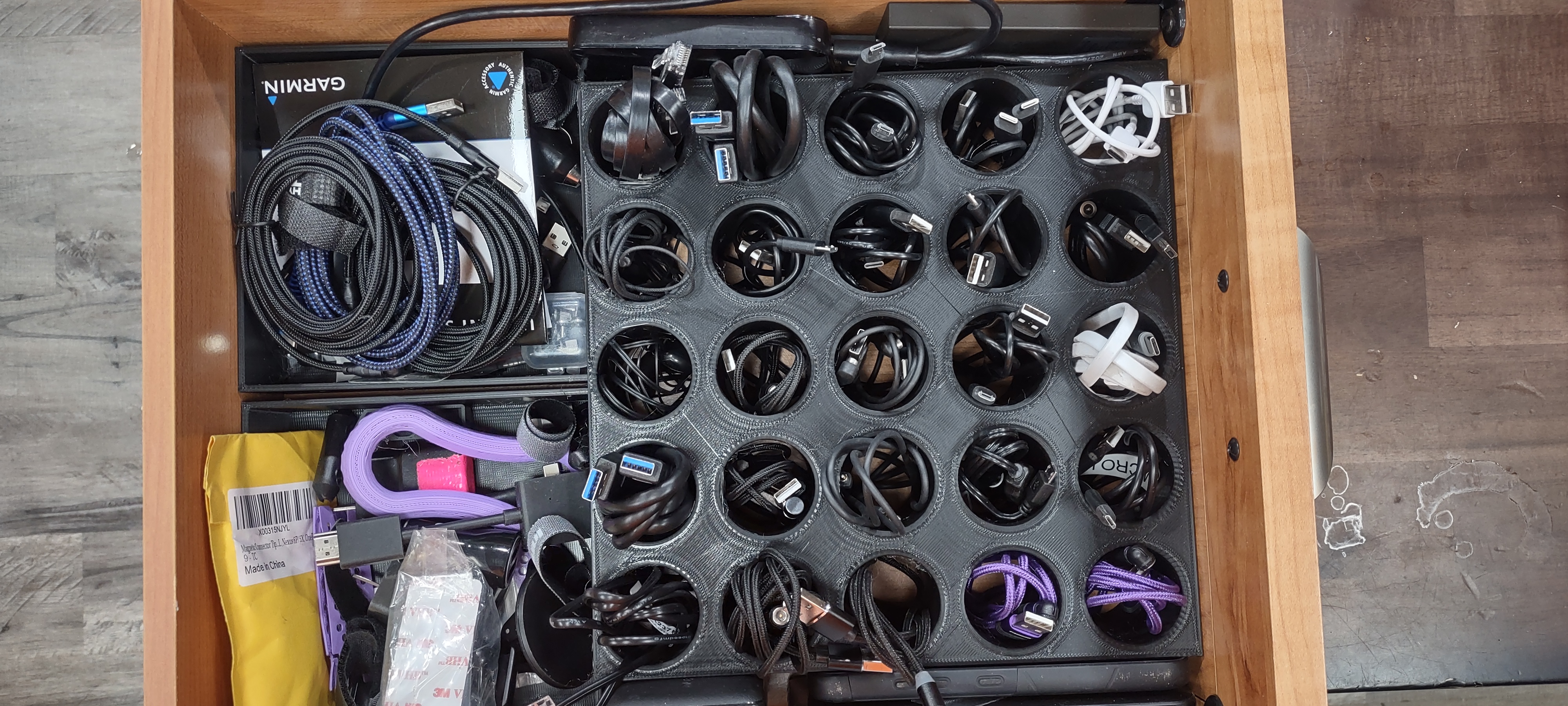 Charge cable draw organizer