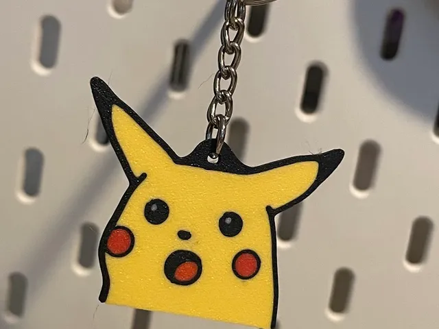 Surprised Pikachu keychain and magnet