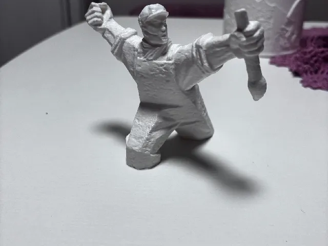 Determined Worker Figurine