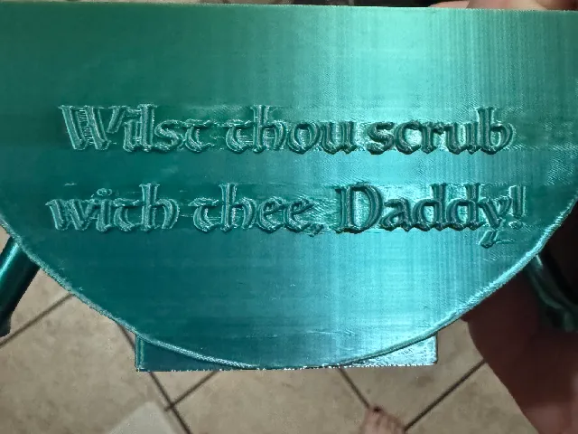 Scrub Daddy holder, with spout. Articulated legs, with funny quote