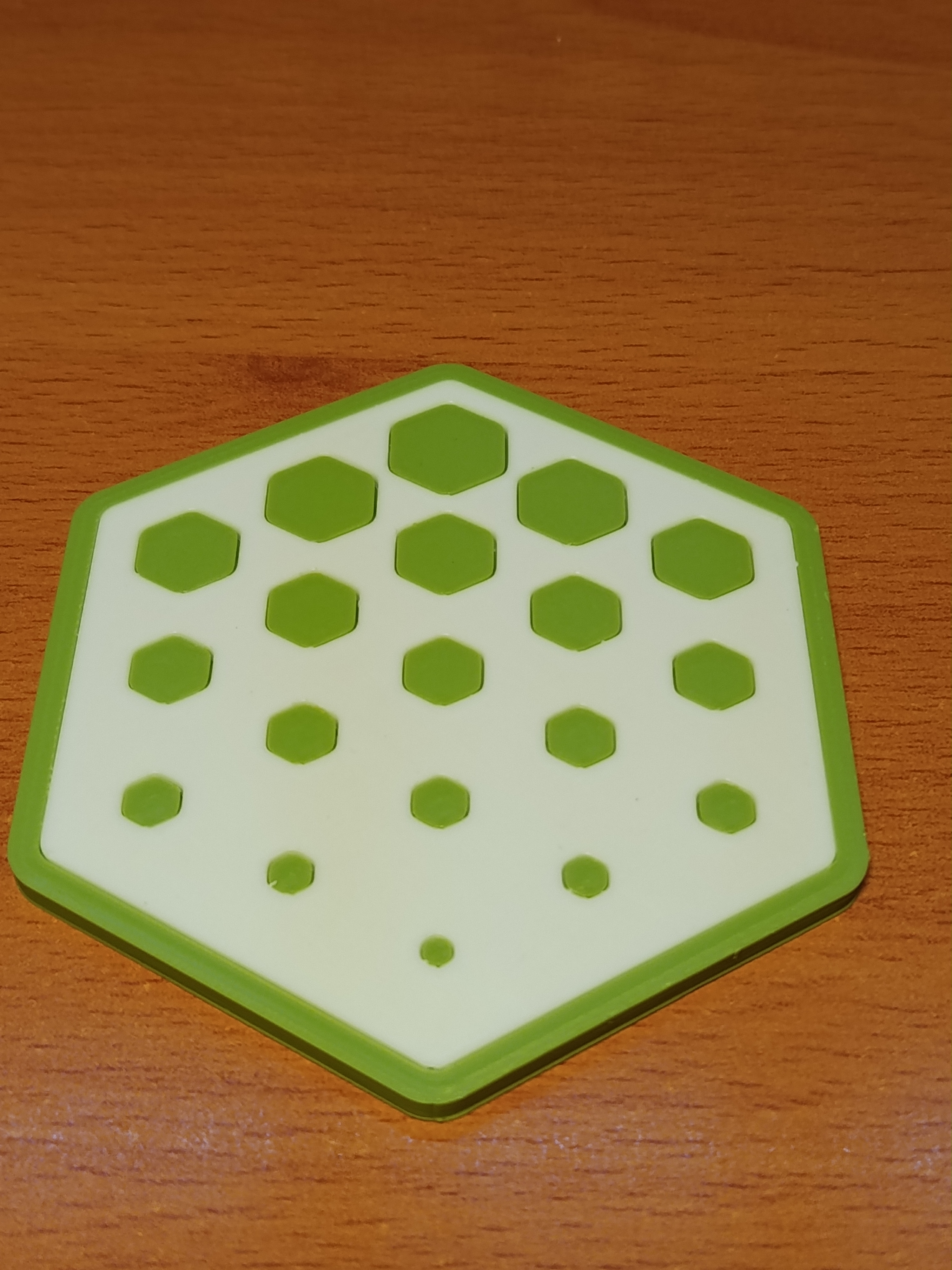 Hexagonal coaster with a pattern that fades away
