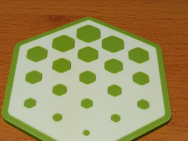 Hexagonal coaster with a pattern that fades away