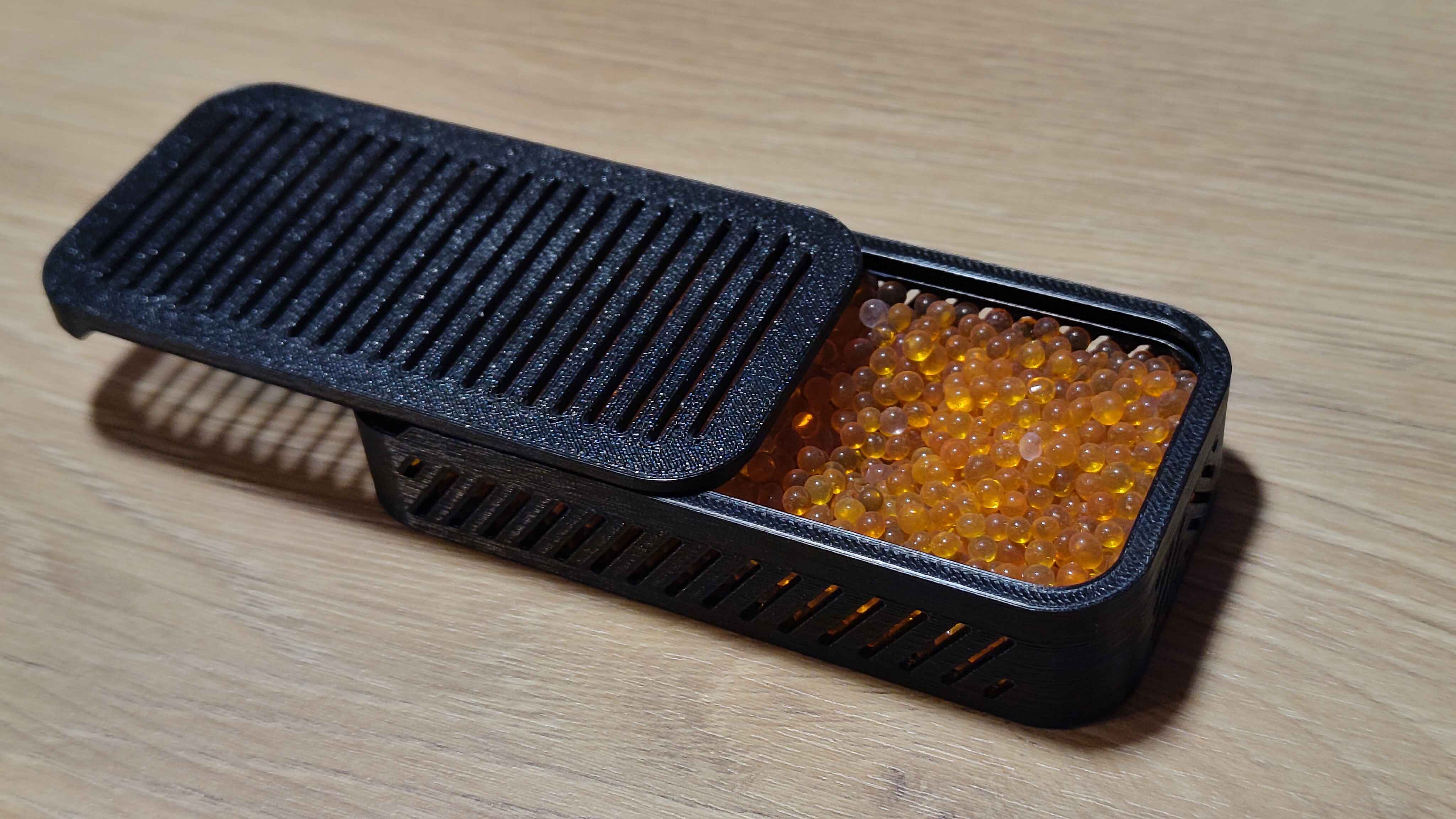 Small compact sliding desiccant box