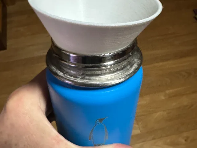 Water bottle funnel for ice dispensers