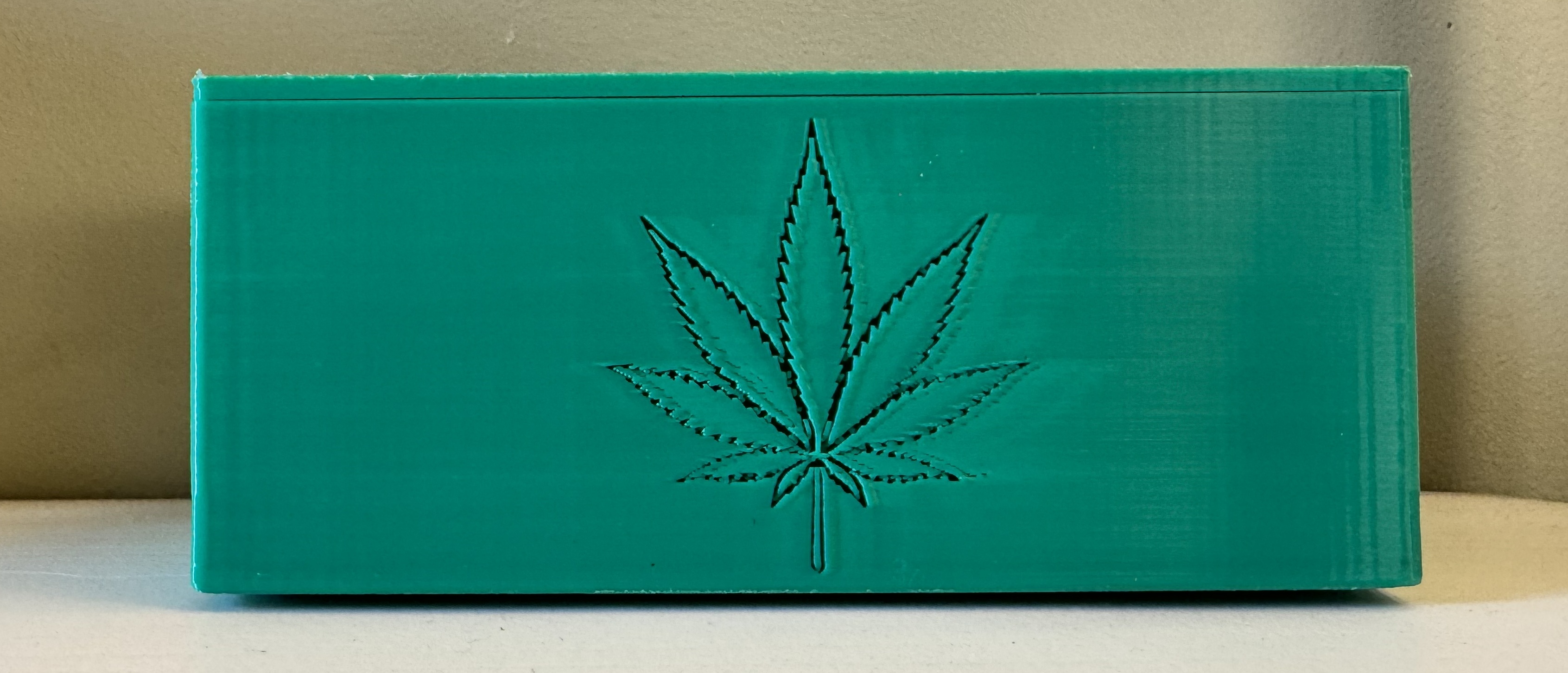 Rolling paper storage box with leaf decals