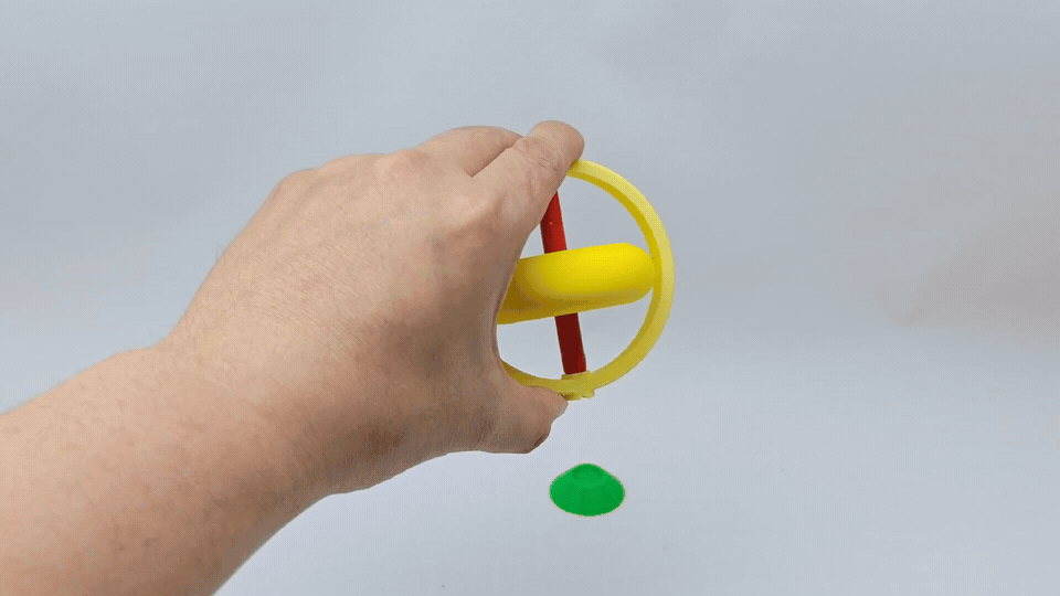 A balancing top that spins on pen tips and strings
