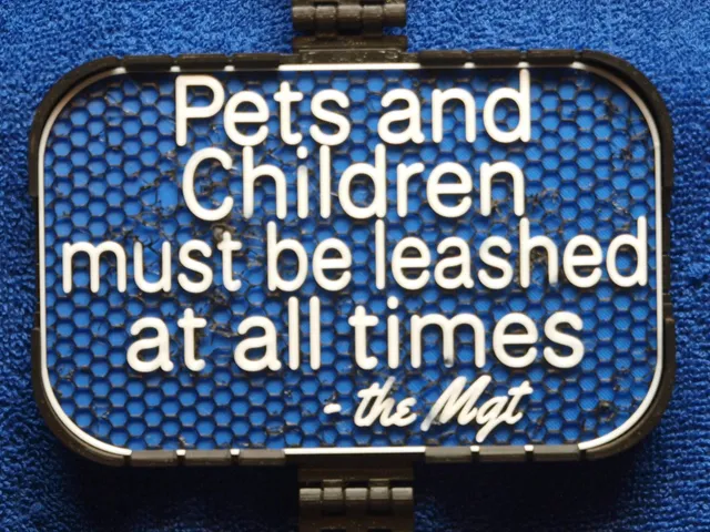 Mgt sign: Pets and Children must be leashed