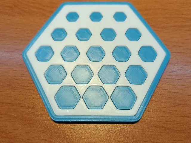 Hexagonal coaster with hexagonal pattern