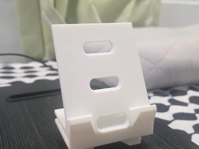 Phone stand with screw and hole for wiring